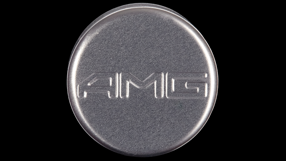 Дебоссинг на алюминиевой крышке логотипа компании